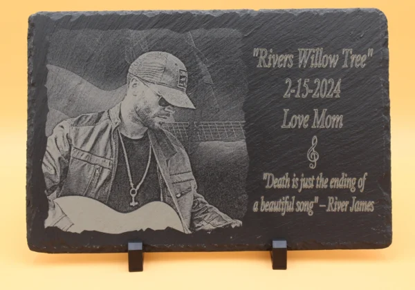 A plaque with a picture of a man holding a guitar.