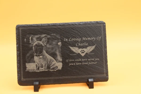 A plaque with an image of a dog on it.